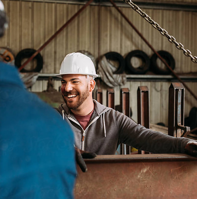 A working man smiling with good health